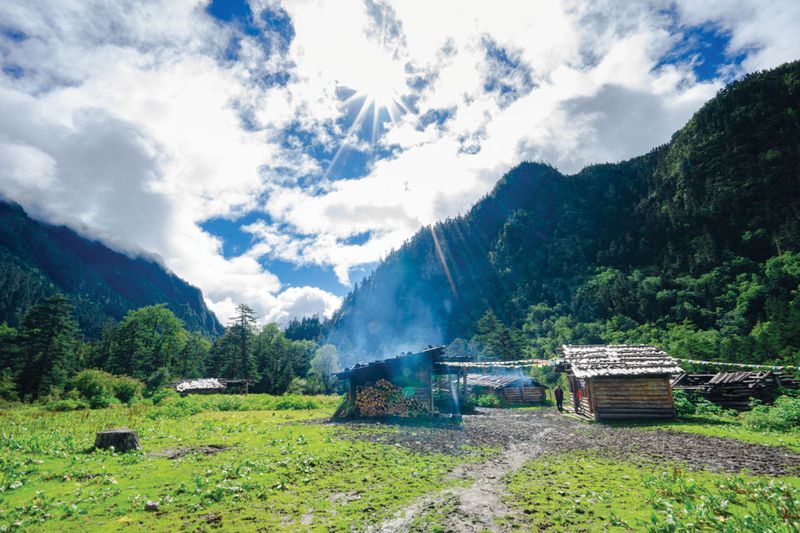 The camp at the base of Kawagarbo Peak has been abandoned since the hiking ban, and is now used either as a cowshed for local herdsmen, or a rest stop for visitors