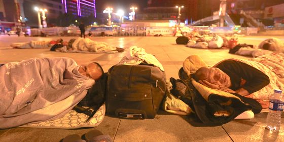 People sleeping at Zhengzhou Railway Station Square