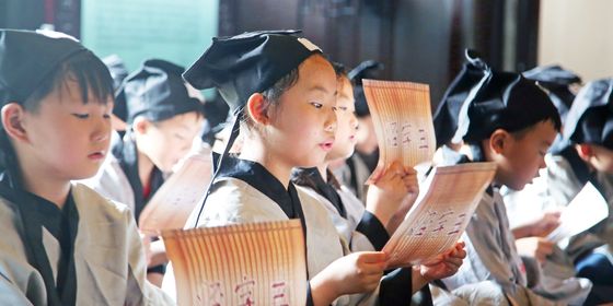 Young Chinese girls reading out loud